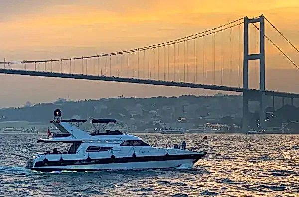 Image of a Bosphorus cruise boat at Istanbul sunset time in Turkey